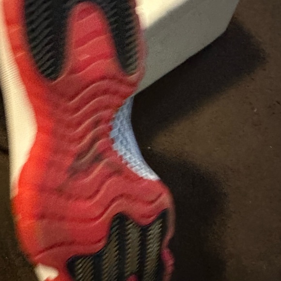 Jordan 11’s.  Black and Red Athletic Shoes